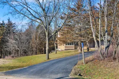 Exterior Retreat: Embrace nature’s beauty from this scenic driveway leading to your getaway!