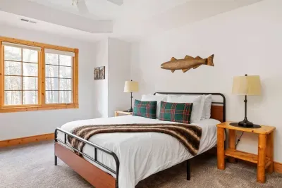 Queen Bedroom: Relax in style with nature views, rustic decor, and plush bedding!