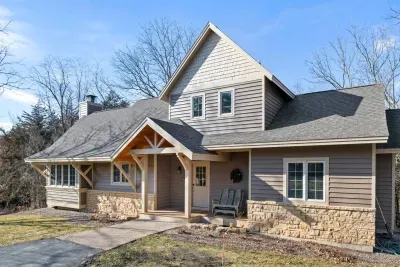 Exterior: Embrace nature on the charming porch of this stunning Galena getaway!