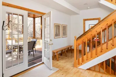 Vaulted Screen Porch: Step into elegance with natural light and warm wood accents leading you to adventure!