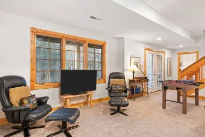 Game Room: Relax, play foosball, and soak in the serene views from large windows!