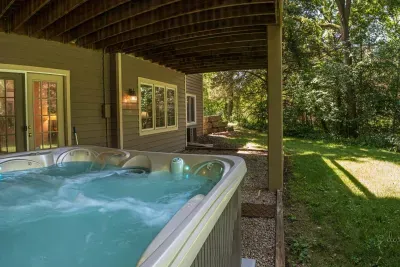 Outdoor Oasis: Unwind in the private hot tub surrounded by serene nature and fresh air!