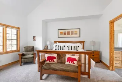 Charming King Bedroom: Bright and airy, featuring rustic decor and inviting views for restful nights!