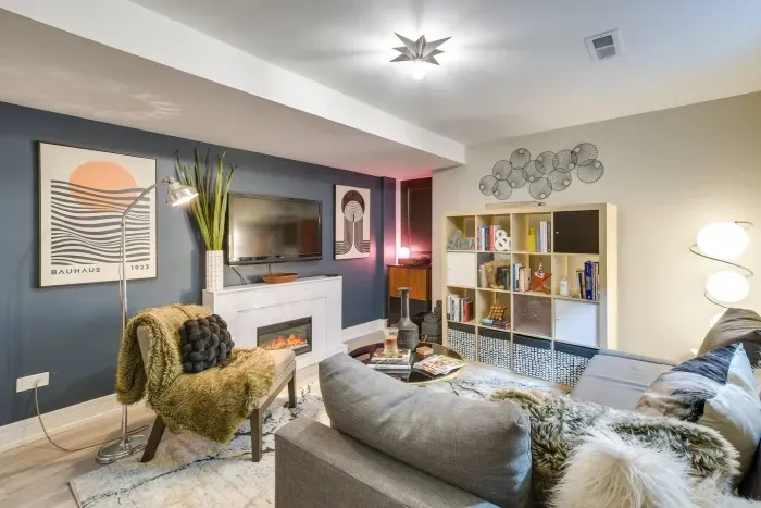 Living Room Retreat: Chic decor, modern furnishings, and a cozy fireplace create a stylish escape!