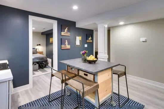 Kitchen: Stylish island bar and artistic decor make cooking a delight in this vibrant space!