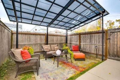 Outdoor Retreat: Enjoy vibrant seating under a stylish canopy perfect for gatherings or relaxation!
