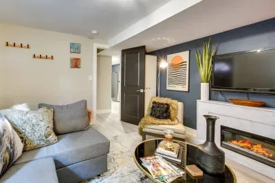 Living Room: Stylish retreat with modern decor, electric fireplace, and a perfect reading nook!