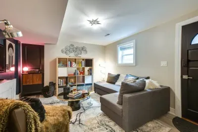 Charming Living Room: Bright space with stylish decor, perfect for relaxation or a book binge!