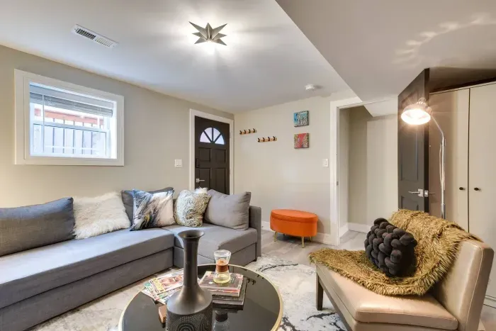 Living Room: Chic comfort awaits in this stylish retreat with vibrant decor and inviting light!