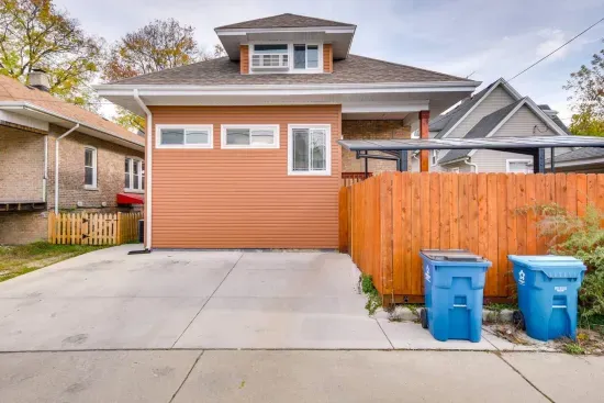 Charming Exterior: Enjoy private parking for one car and a warm welcome in vibrant Forest Park!
