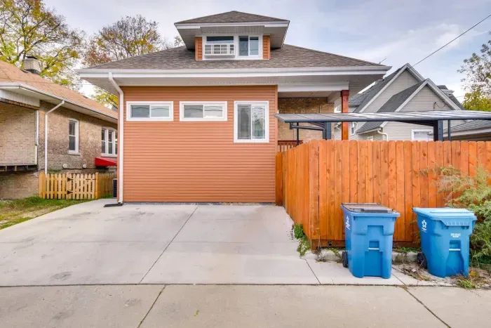 Charming Exterior: Enjoy private parking for one car and a warm welcome in vibrant Forest Park!