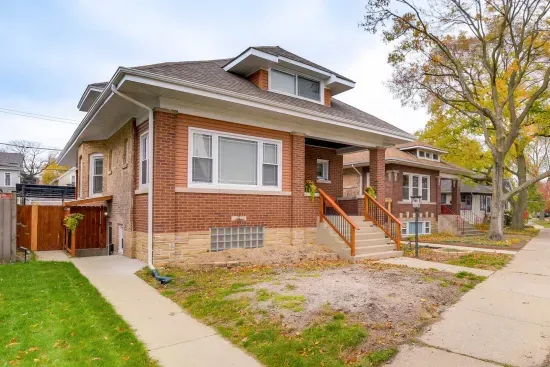 Charming Exterior: Experience vibrant neighborhood life from this inviting brick home!
