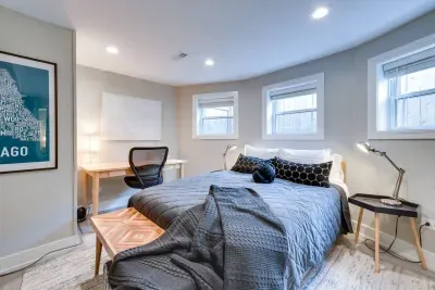 Bedroom Oasis: Bright, airy retreat with a stylish desk and modern decor for your perfect stay!