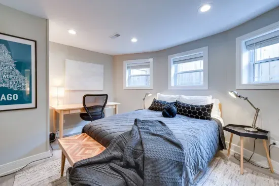 Bedroom Oasis: Bright, airy retreat with a stylish desk and modern decor for your perfect stay!