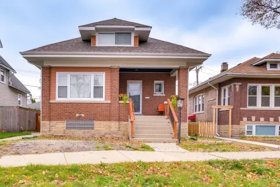 Charming Exterior: Step into a welcoming retreat with beautiful brickwork and vibrant landscaping!