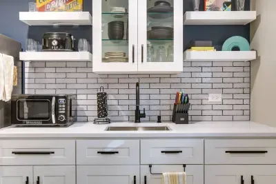 Kitchen: Sleek modern design with a pop of color—perfect for culinary adventures!