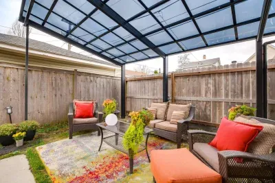 Outdoor Lounge: Enjoy vibrant gatherings under a stylish canopy, surrounded by lush greenery!