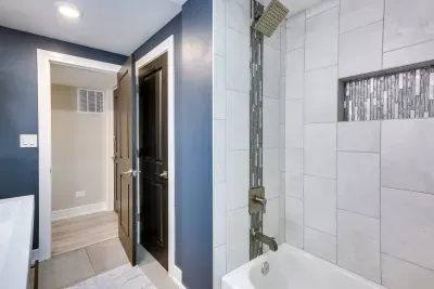 Spa-Like Bathroom: Modern fixtures and sleek tiles for a refreshing retreat after your adventures!