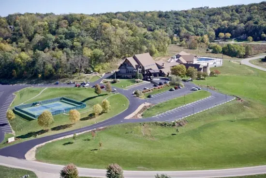 The Owners Club Exterior Overview: Scenic views and lush surroundings with tennis courts, gym, multiple pools for active fun!
