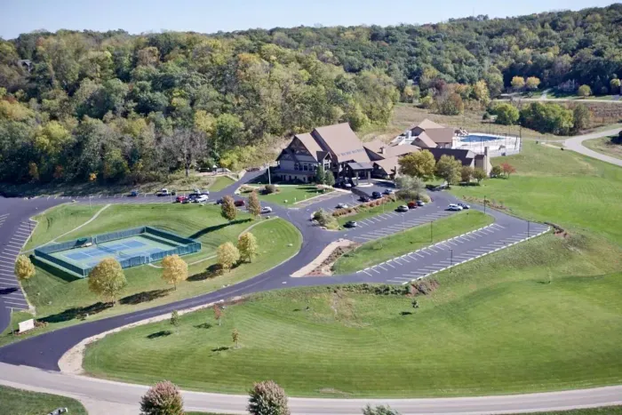 The Owners Club Exterior Overview: Scenic views and lush surroundings with tennis courts, gym, multiple pools for active fun!