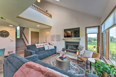 Living Room Retreat: Enjoy breathtaking views and modern comforts by the fireplace!