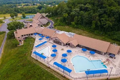 Outdoor Oasis at The Owners Club: Dive into fun with our sparkling pools and vibrant sun loungers. Perfect for relaxation!
