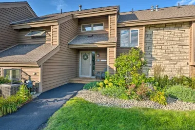 Exterior Entrance: Inviting front facade with lush greenery and charming decor awaits your arrival!