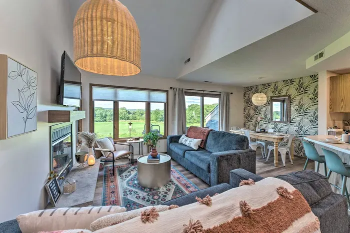 Living Room Oasis: Enjoy stunning golf course views and chic decor in this light-filled retreat!