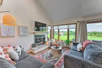 Living Room: Brighten your stay with stunning views, plush seating, and a stylish fireplace!