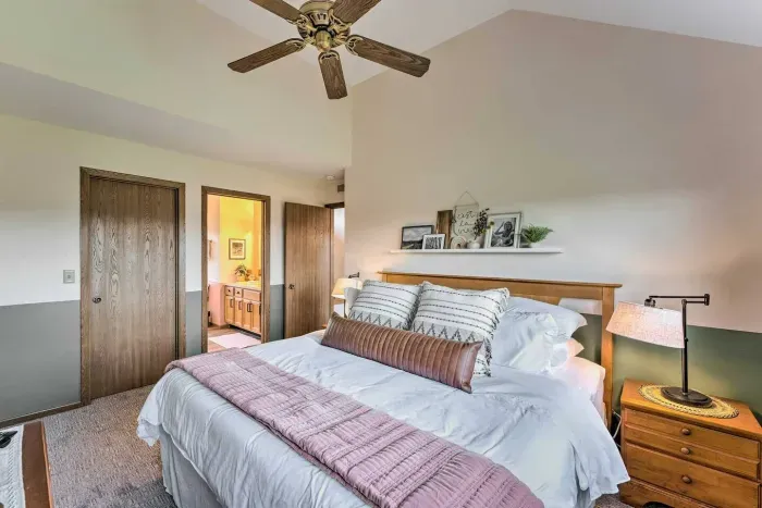 Upper-Level Bedroom: Bright retreat with fluffy bedding and stylish decor for your perfect getaway!