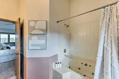 Upper Level Bathroom: Indulge in a spa-like retreat with a whirlpool tub and serene decor!