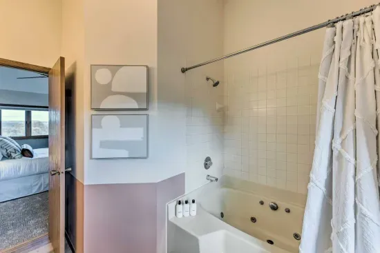 Upper Level Bathroom: Indulge in a spa-like retreat with a whirlpool tub and serene decor!