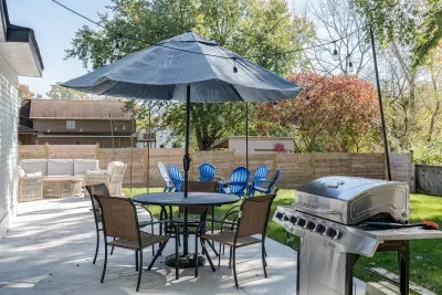 Outdoor Patio: Gather around the grill and enjoy sunny afternoons under the vibrant umbrella!