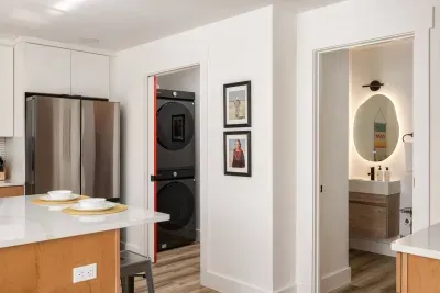 Modern Kitchen & Additional Full Bath: Enjoy seamless cooking with sleek appliances and stylish design.