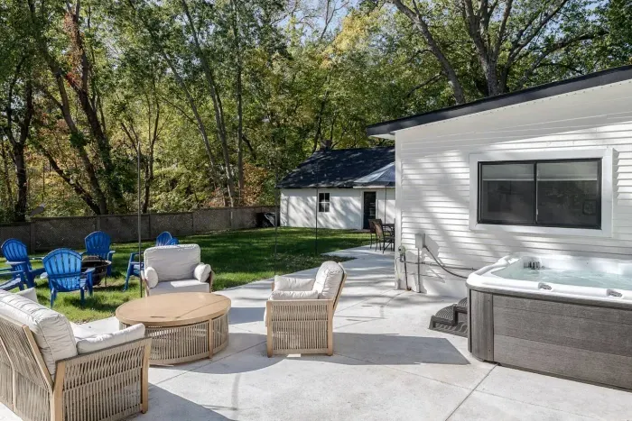 Outdoor Oasis: Relax in style with a private hot tub and views of lush greenery!