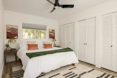 Bedroom Retreat: Serene space with sunny views, stylish decor, and plush bedding awaits you!