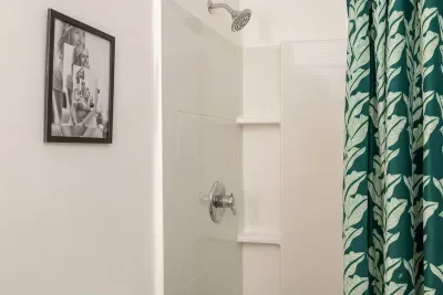 Bathroom Bliss: Refresh in this sleek shower with stylish tropical accents!