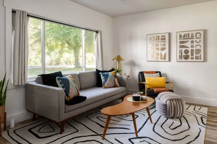 Living Room: Sun-drenched space with modern decor, perfect for relaxation and playful gatherings!