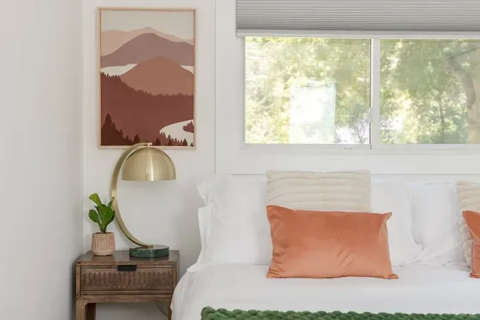 King Bedroom: Tranquil retreat with vibrant decor and natural light, perfect for restful nights.