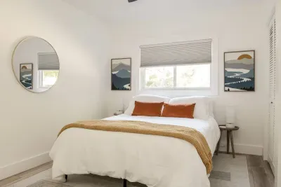 Bedroom Retreat: Bright and airy space with nature-inspired decor and scenic window views!