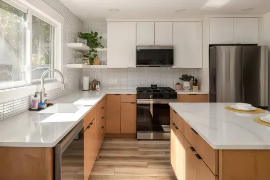 Kitchen: Experience culinary magic in this sleek, sunlit space with modern appliances and vibrant accents!