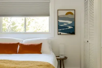 Charming Bedroom: Bright and airy retreat with artful decor and serene views for blissful relaxation!