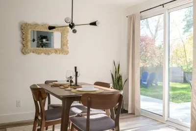 Dining Room: Enjoy meals in style surrounded by natural light and a chic, modern vibe! Bar cart added for extra fun this year!