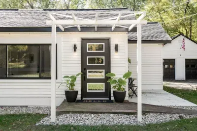 Welcoming Entrance: Experience modern charm with stylish decor and vibrant greenery!