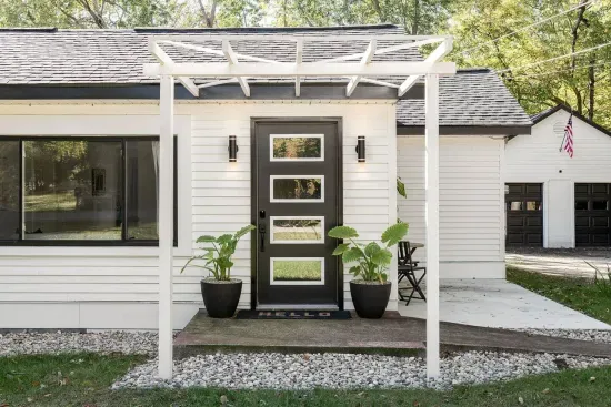 Welcoming Entrance: Experience modern charm with stylish decor and vibrant greenery!