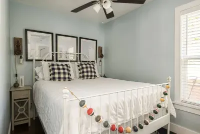 Bedroom Retreat: Relax in this bright space with nautical decor and plush bedding!