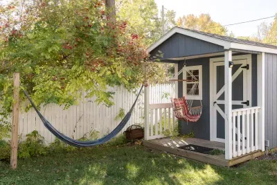 Charming Backyard Retreat: Relax in a hammock under vibrant foliage, just steps from your door!