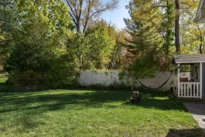 Backyard Oasis: Enjoy sunny afternoons in the spacious yard with a hammock and firepit!