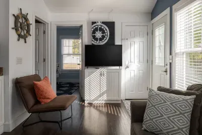 Living Room: Bright and airy space with nautical decor, perfect for relaxation and fun!