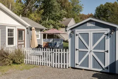 Charming Outdoor Space: Enjoy alfresco dining under the shade, perfect for sunny Michigan days!